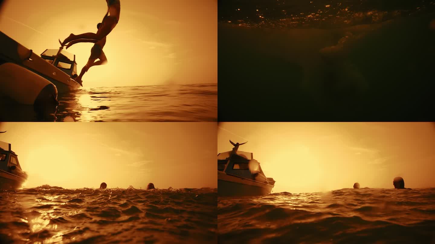 日落时分，一对夫妇一起从船上跳入海水的慢动作剪影