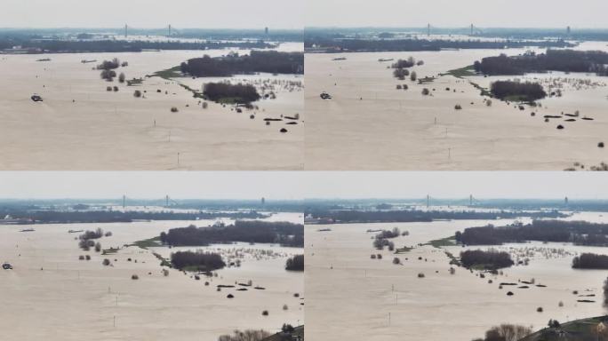 航拍的瓦尔河被暴雨冲垮了河岸，淹没了农田和村庄，背景是Martinus Nijhoffbrug桥和Z