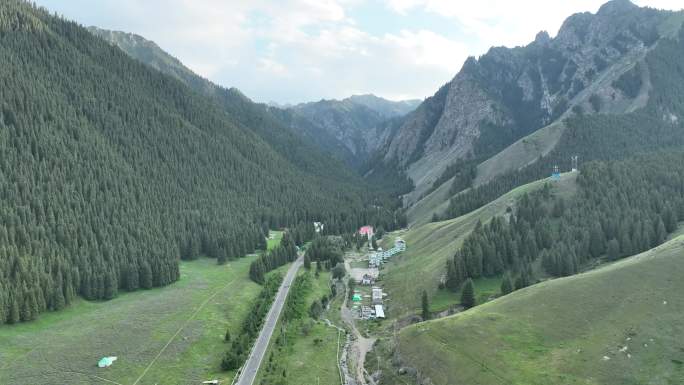航拍新疆绿树山脉村庄
