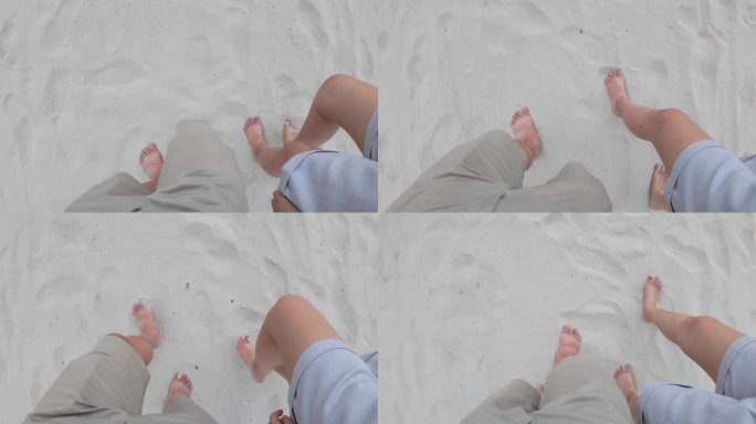 引人入胜的视角镜头，一个人的腿在沙地上行走