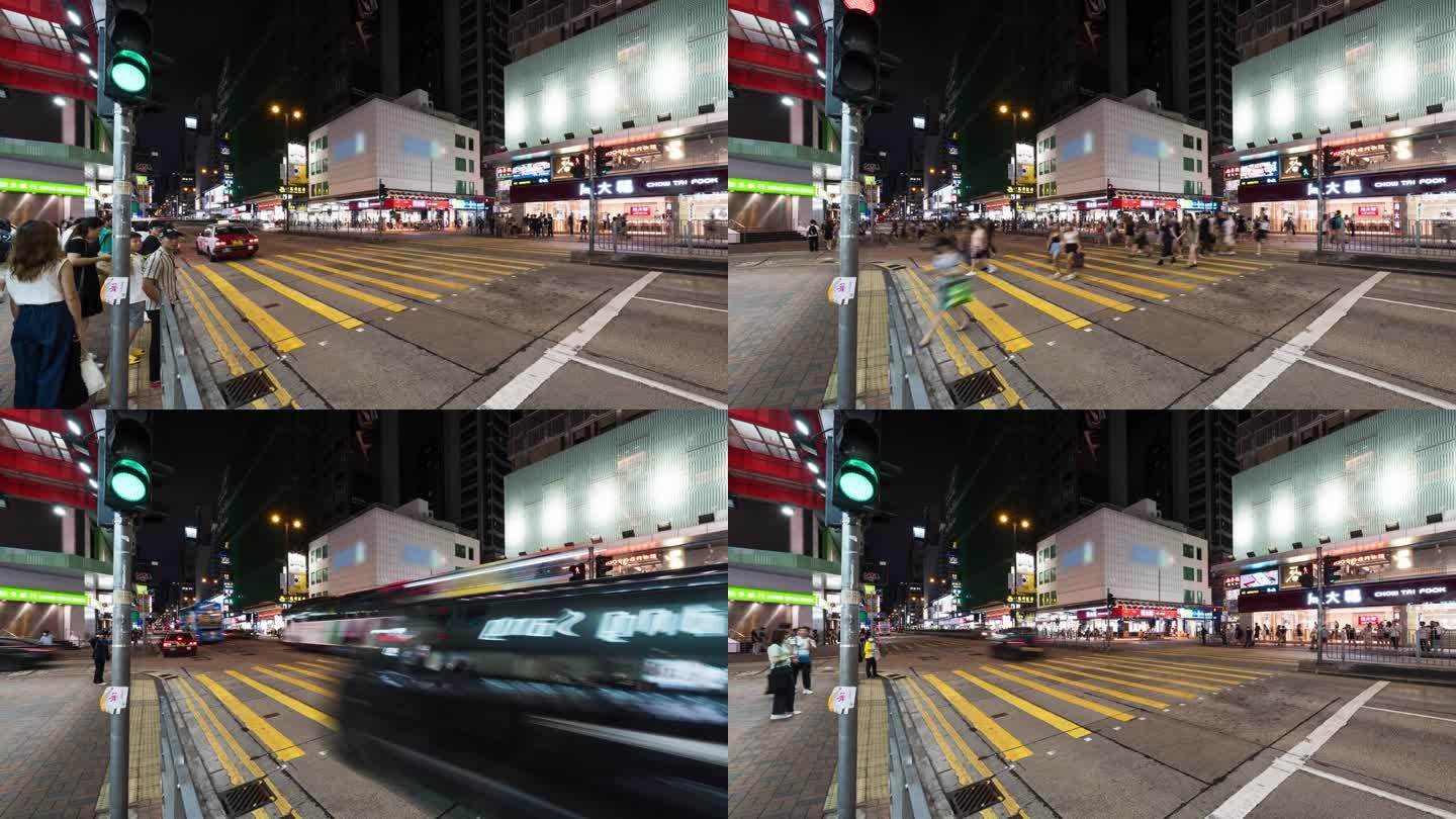 走过香港旺角购物区的斑马线。汽车和出租车