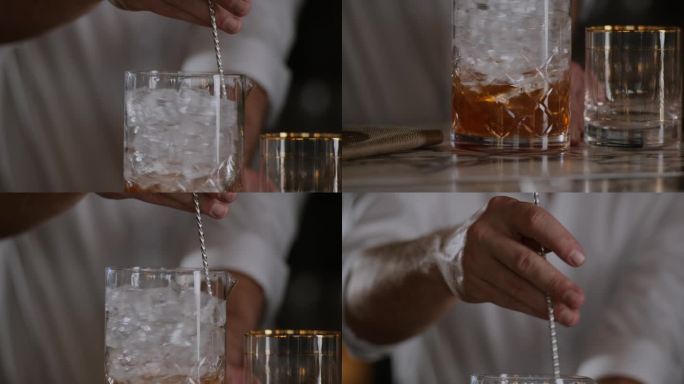 调酒师在一个大的调酒杯中搅拌加冰的老式酒