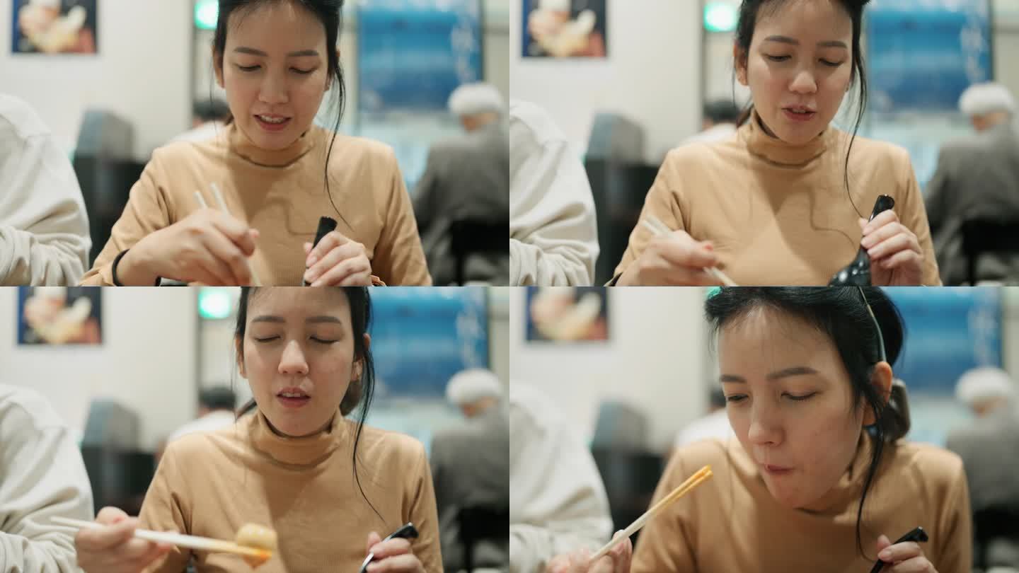 一位年轻女子用筷子吃饭的正面照片