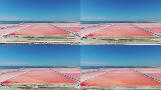 飞过阿尔巴尼亚海盐农场，粉红色的沉淀物，蔚蓝的海边