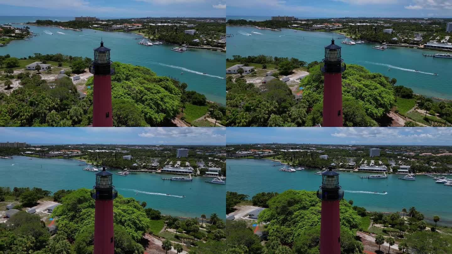 无人机拍摄的朱庇特灯塔在佛罗里达州的船只在海洋中经过。