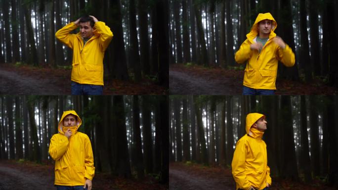 男子冒着可怕的森林雨，不舒服地拉上黄色雨衣的拉链