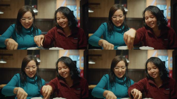 女商人和她的朋友晚餐吃日式烧肉