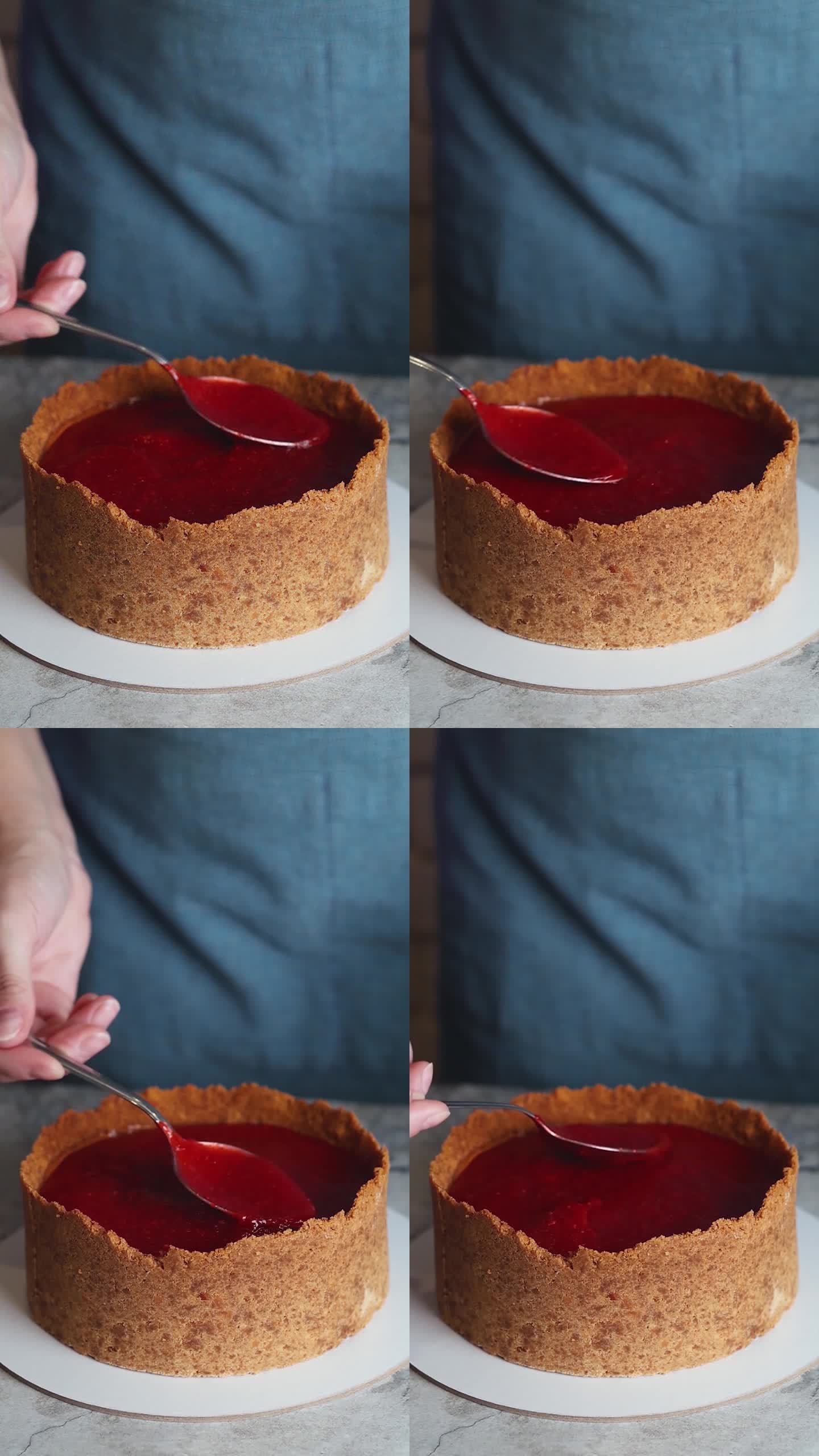 女性用手制作起司蛋糕，在厨房用草莓装饰香草起司蛋糕特写慢动作垂直视频镜头特写