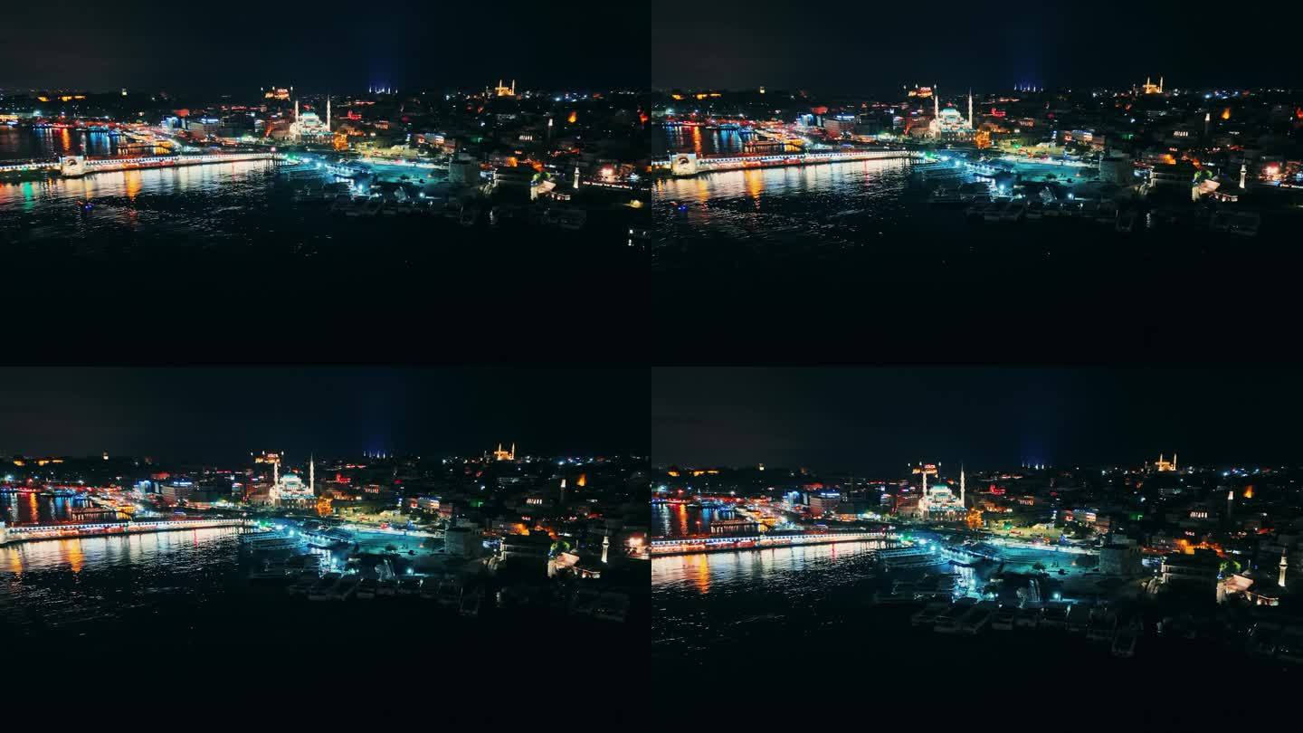 航拍伊斯坦布尔的夜间交响曲:加拉塔桥和耶尼·卡米清真寺被照亮了#城市之光#金色号角魔术#无人机景观