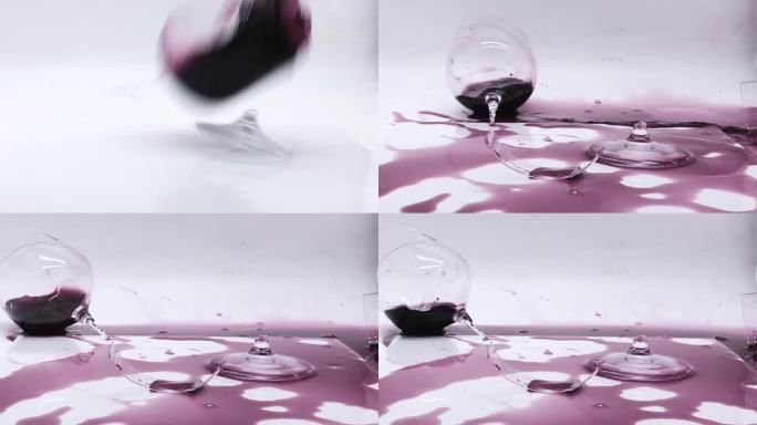 装有红酒的玻璃杯不小心跌落并爆炸成碎片，玻璃杯在表面旋转时形成波浪