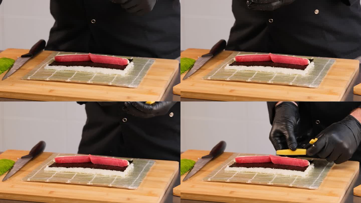 制作寿司卷的过程。专业厨师准备寿司。