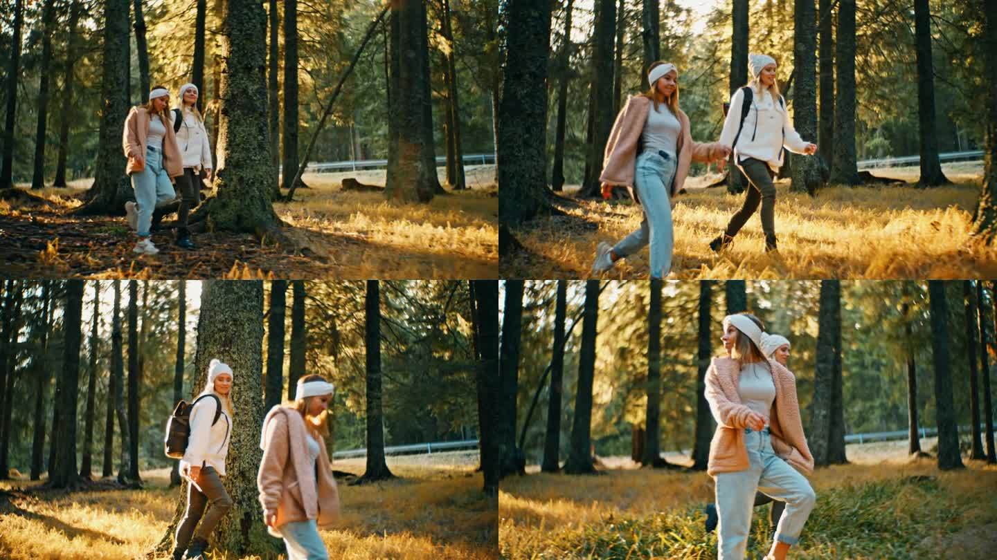 慢动作的年轻女子在阳光明媚的秋天森林里的树林中徒步行走