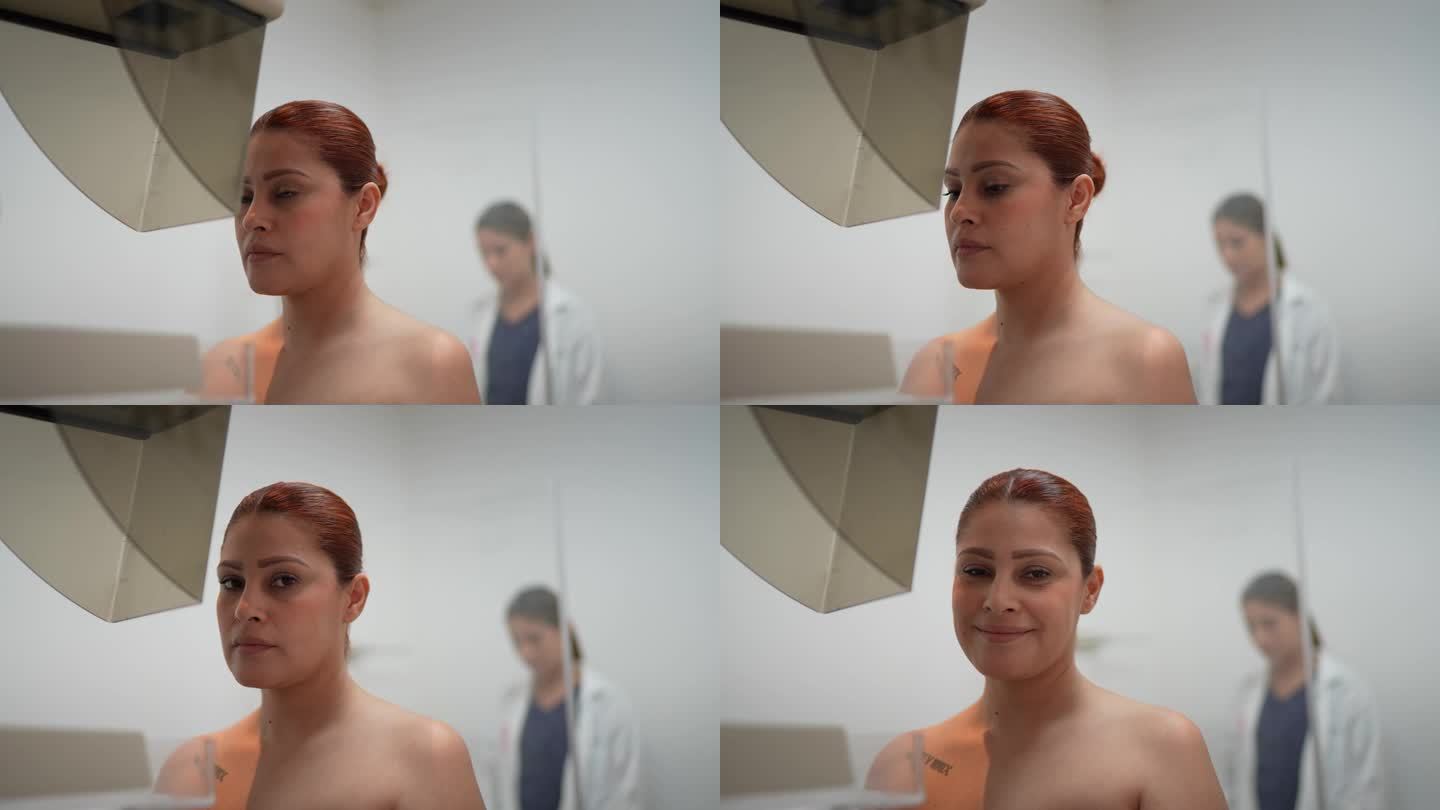 图为一位中年妇女在医院做乳房x光检查