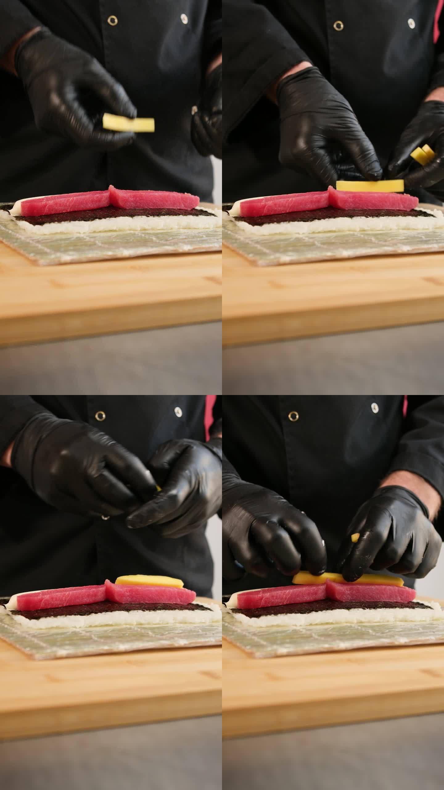 制作寿司卷的过程。专业厨师准备寿司。