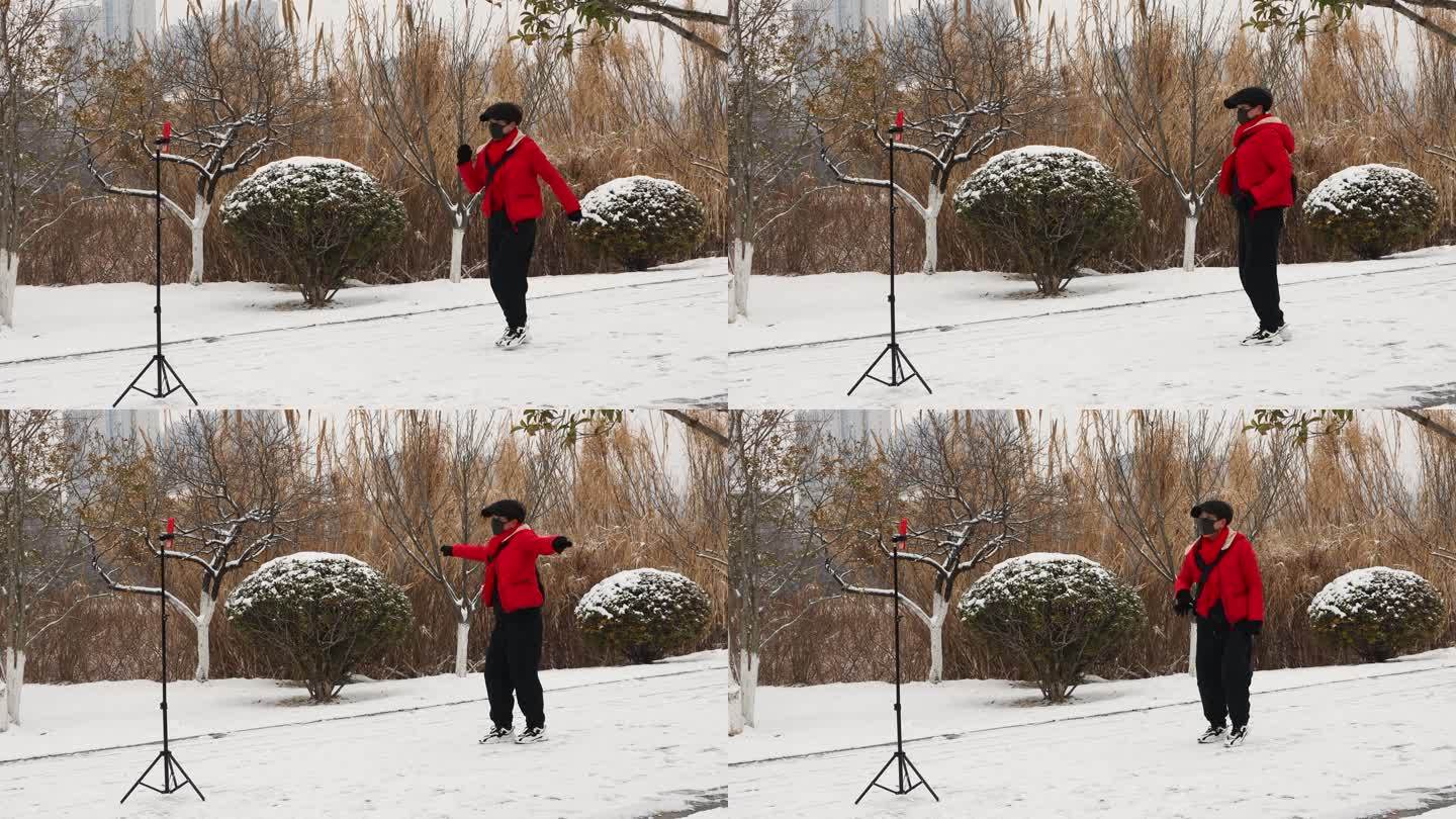 一名女性在雪地上跳舞 录制短视频