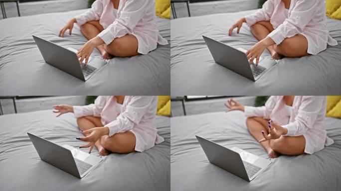 清醒和集中，女人冥想与在线瑜伽练习，双手在床上的姿势在放松的卧室
