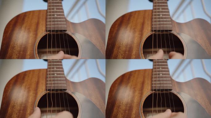 近距离吉他演奏，短镜头曝光下的弦振动与波动。