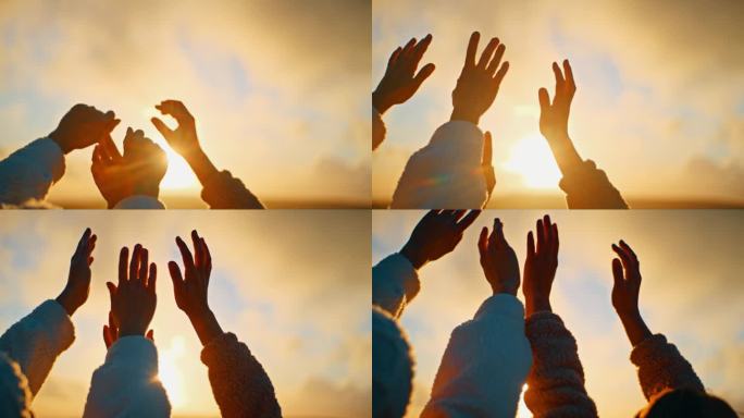 慢镜头:年轻的女人在日出时朝着金色的阳光举起双手