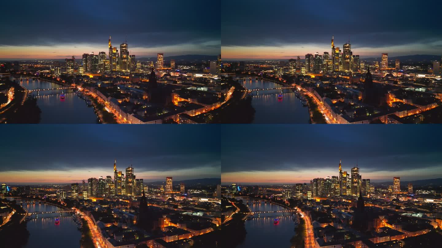 4K鸟瞰图法兰克福的主要天际线的实时镜头，虽然美因河和现代金融大楼和摩天大楼与法兰克福大教堂在日落时