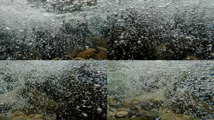 汹涌的水流混合着气泡流入大海的全景图