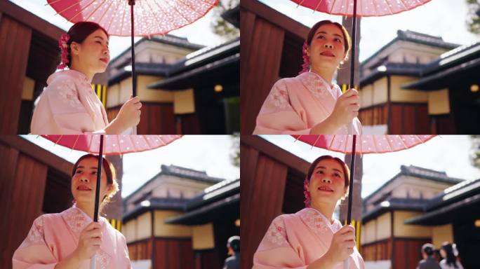穿着传统和服的亚洲妇女走在日本的老城区