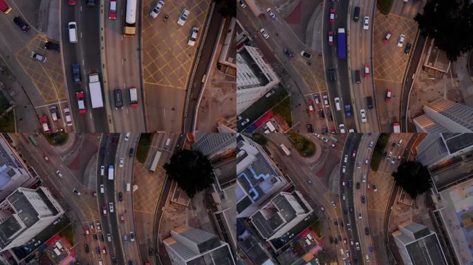 这张照片显示了在下午晚些时候的高峰时段，香港彩虹邨附近繁忙的观塘绕道。高速公路和道路上挤满了汽车、出