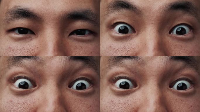亚洲男子脸的肖像与大惊讶的眼睛看着镜头近距离。具有民族特色的中国青年的惊人视野。一个学生惊恐、震惊地