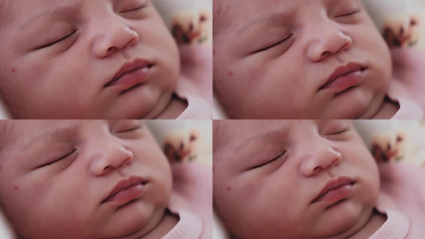 新生儿睡觉时脸部的细节照片