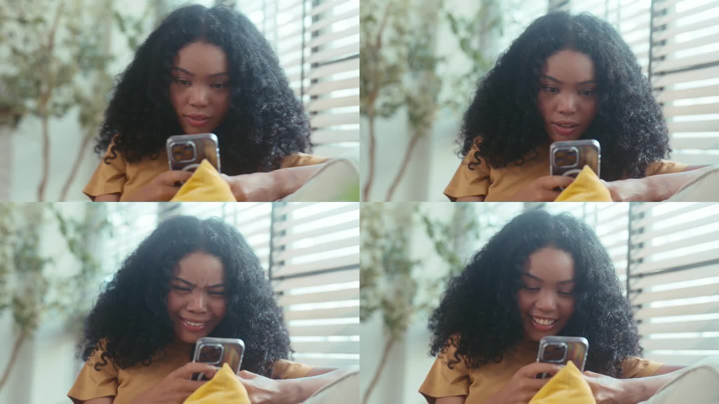 快乐的非裔美国妇女对室内智能手机好消息的反应