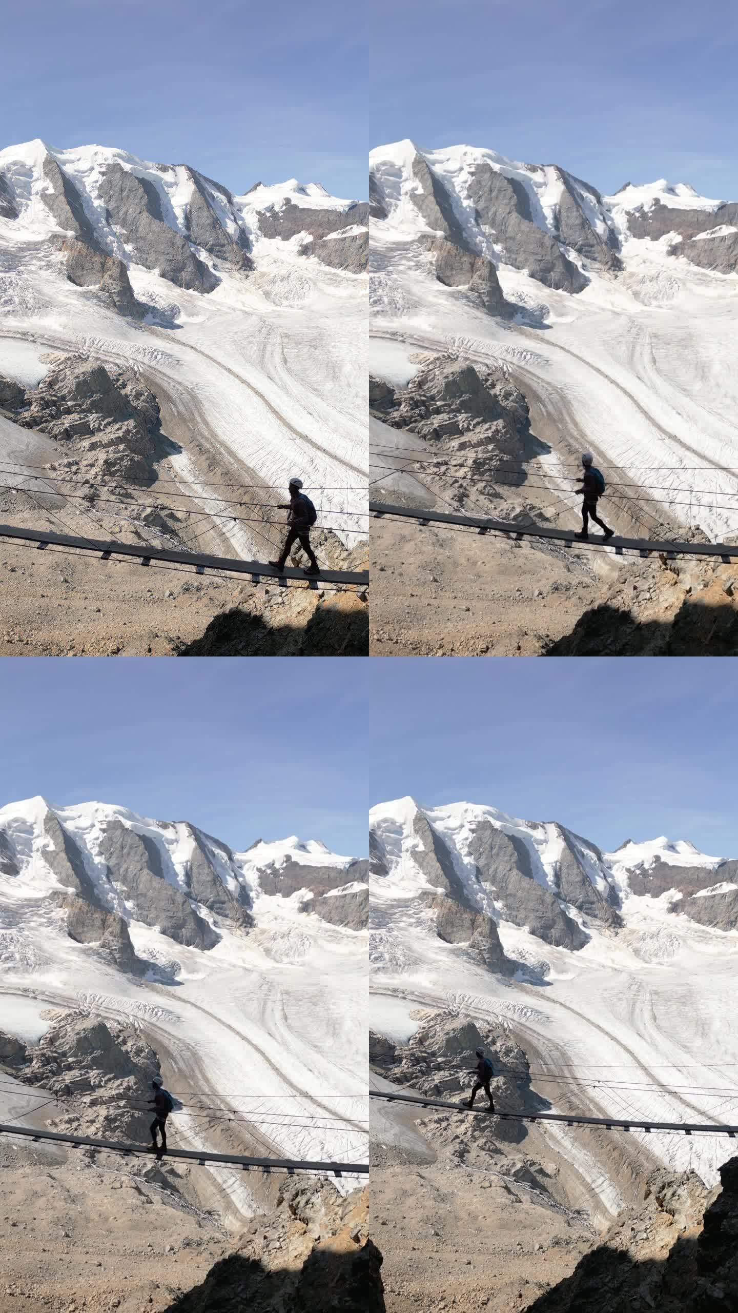 一名妇女在阿尔卑斯山的Ferrata大道上攀登，在冰川之上