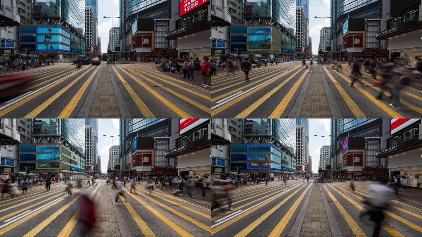 中国人走过香港旺角购物区的斑马线。