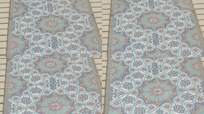 铺有图案的瓷砖的地板。马赛克地板的特写。明亮的瓷砖。4 k。