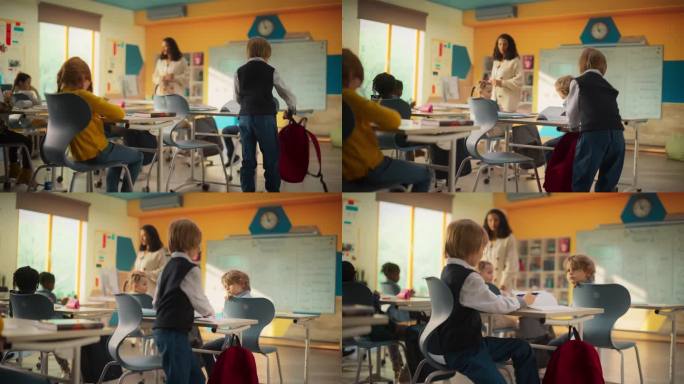 一个快乐的男孩的肖像，兴奋地走进教室，收起他的红色背包，坐在桌子后面。不同的孩子在现代小学学习。后面