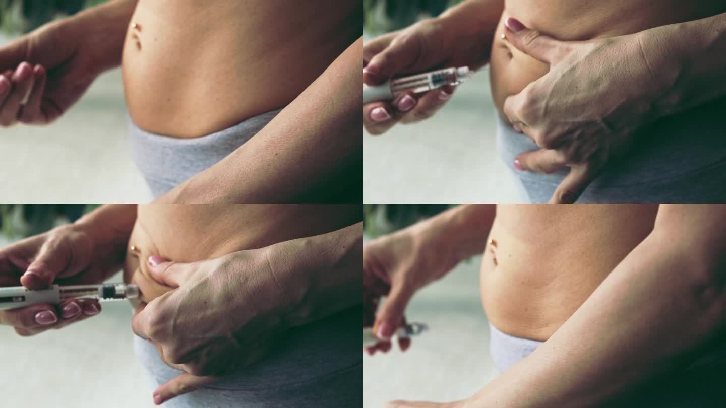 近距离镜头显示，这名女子用美丽的双手准备激素药物，并在肚脐穿孔的情况下将自己注射到腹部。