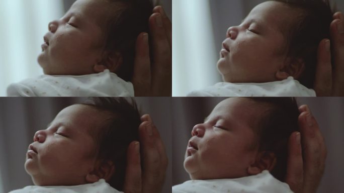 新生儿的头头部保护头部按摩头部发育
