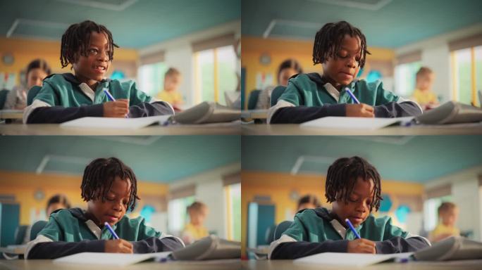 聪明的留着脏辫的非洲小男孩坐在小学的桌子后面。细心的非洲年轻人在笔记本上写下笔记，找到解决练习的方法