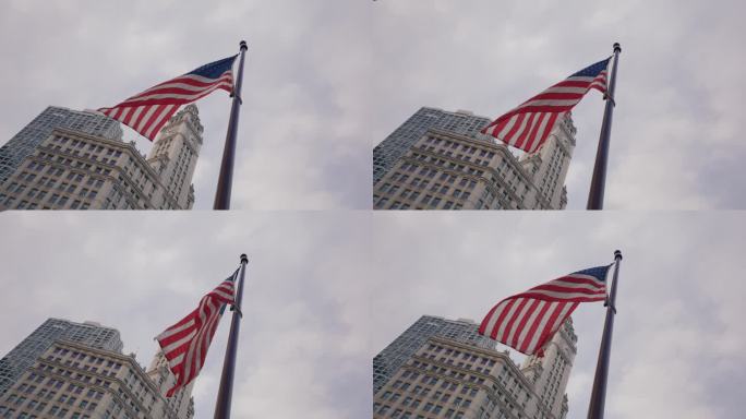 慢动作的美国国旗在风中飘扬。背景是芝加哥的摩天大楼
