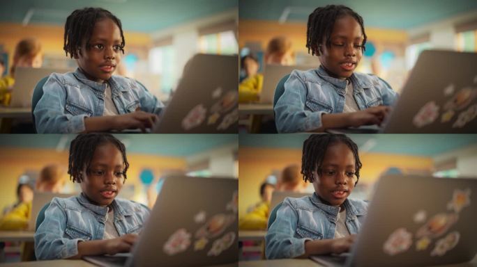 天才的非裔美国小男孩在课堂上使用笔记本电脑。一个快乐的小学生的肖像努力学习，学习新事物，在网上获得现