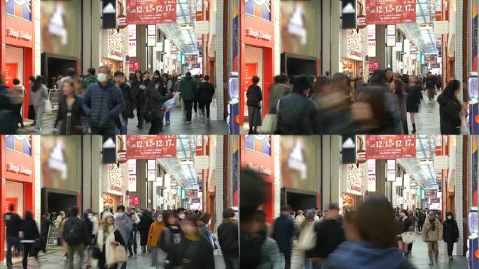 延时摄影:日本大阪新斋桥购物街的行人和游客
