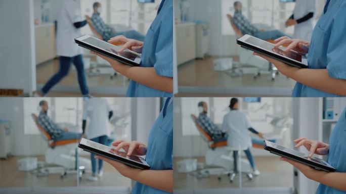 现代触屏平板电脑和护士手特写