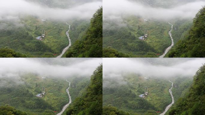 宁静的村庄在鲁远坪峡谷在雨天，多云和毛毛雨的日子，小溪在山谷中流淌。高角度观看4k慢动作镜头。
