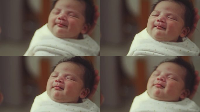 新生儿的微笑宝宝笑容婴幼儿笑颜快乐的宝宝