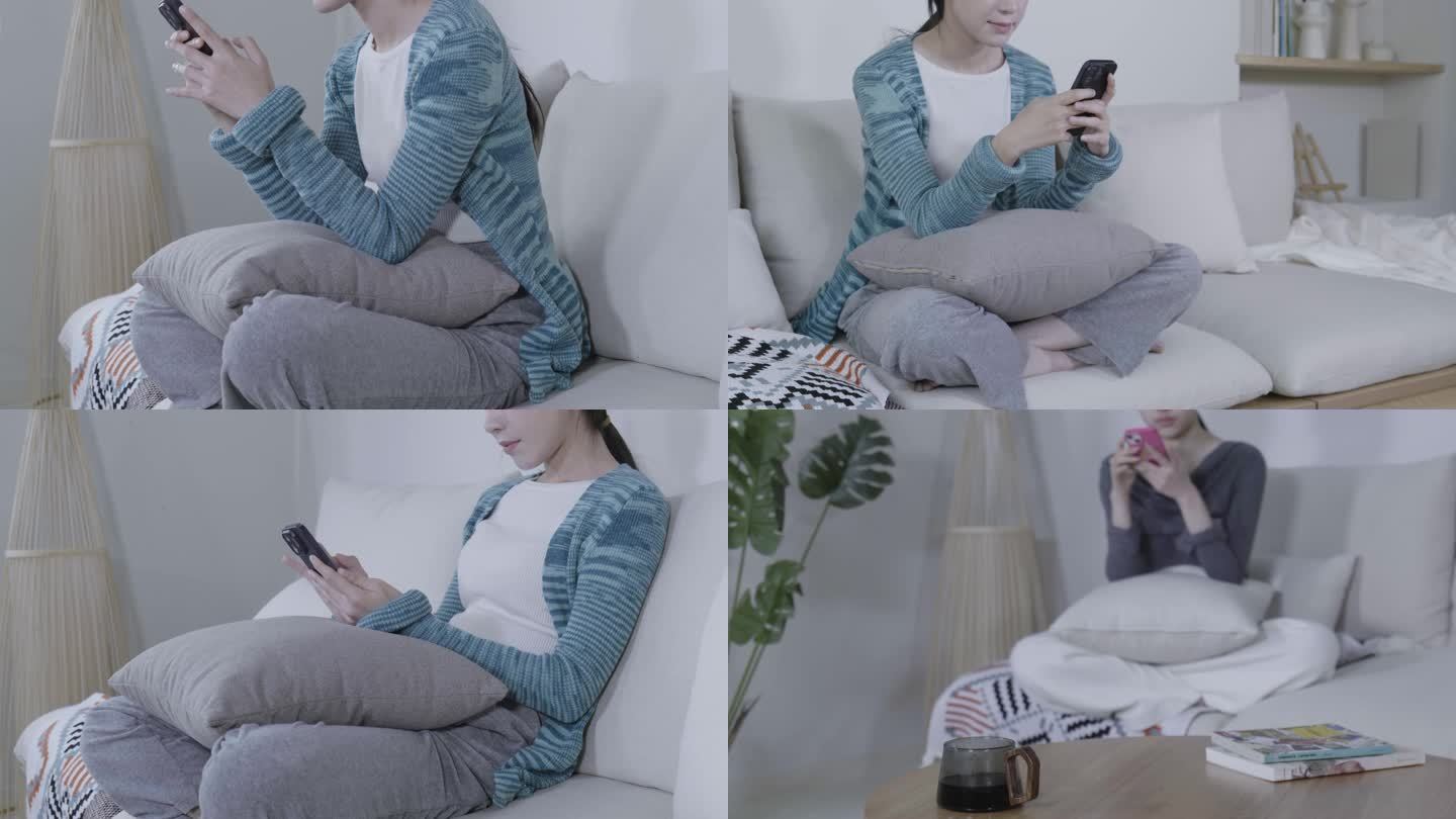 美女坐沙发放松玩手机