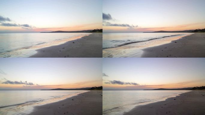 日落在科尔斯湾在弗莱辛内国家公园在塔斯马尼亚，澳大利亚，延时滑块