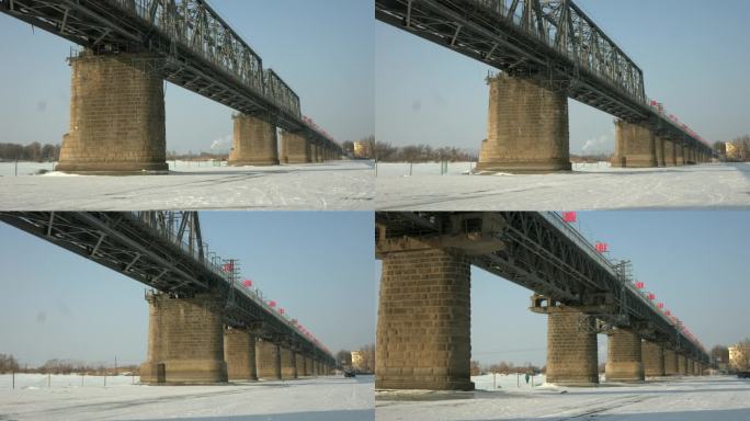 航拍冬季哈尔滨松花江冰面铁路大桥