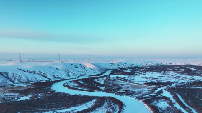 航拍冬季呼伦贝尔雪原风力发电