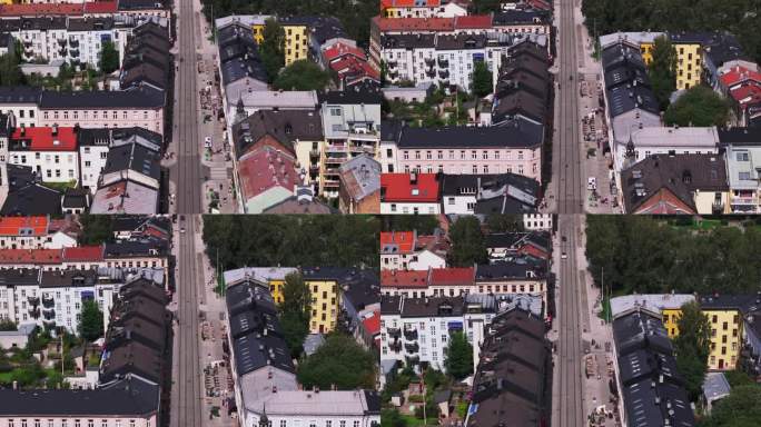 前锋在市区街道上空飞行。有电车轨道的行人大道的高角度视图。挪威奥斯陆