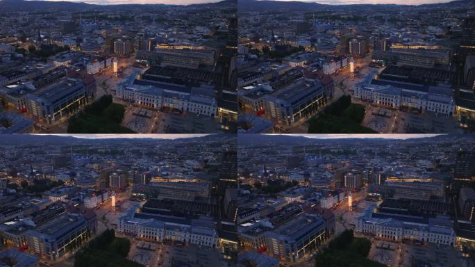 黄昏时城市鸟瞰图。中央火车站和广场，公共交通总站。挪威奥斯陆