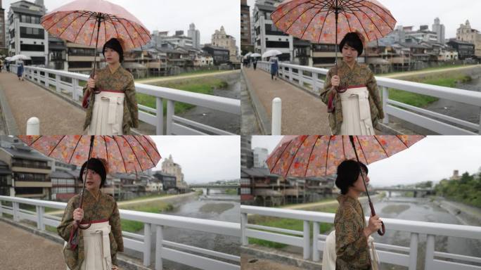 穿着和服/袴的年轻女子穿过加墨河上的桥。