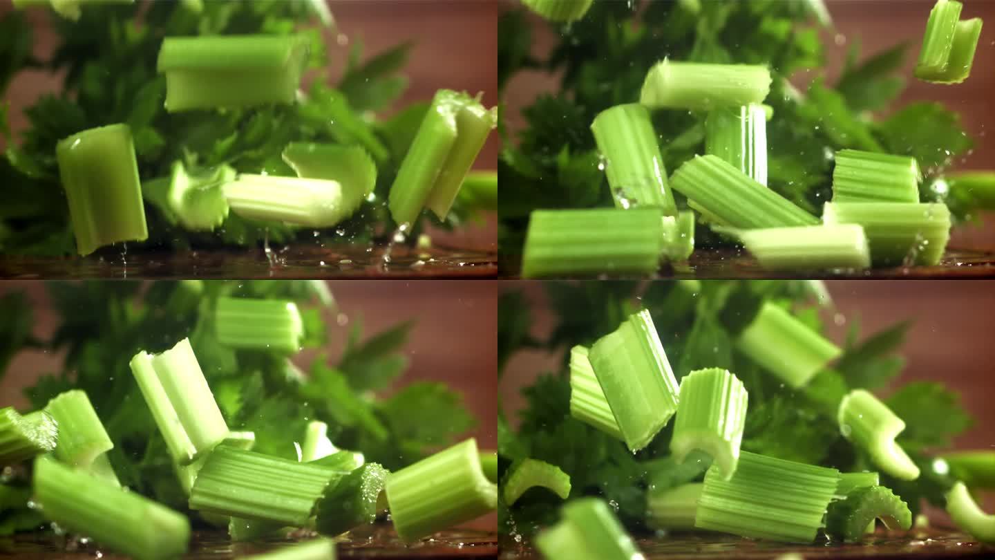 芹菜碎掉在桌子上。用高速摄像机拍摄，每秒1000帧。